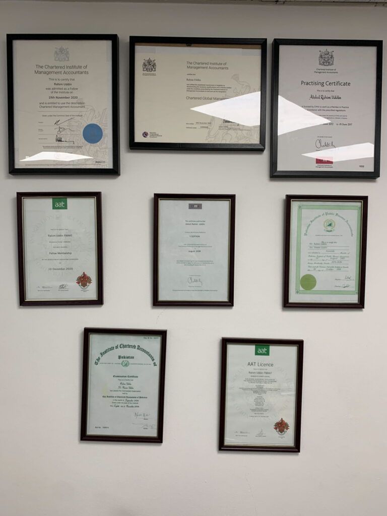 artifin-accountants-framed-certificates-on-white-wall