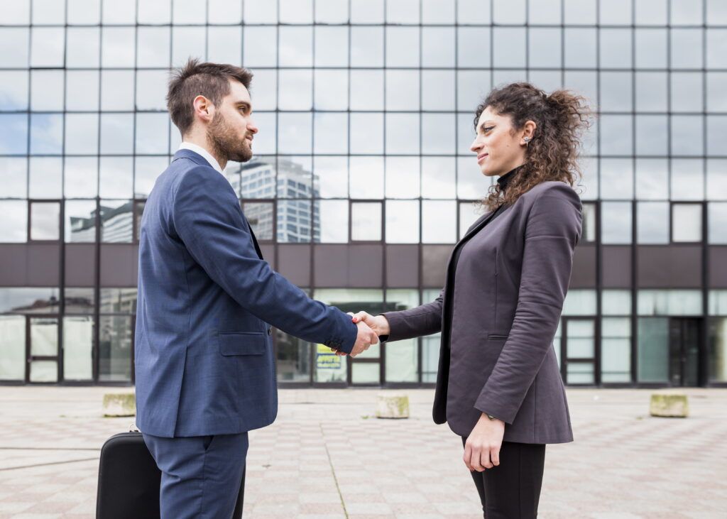 business-people-shaking-hands-infront-of-firm-artifin-accountants