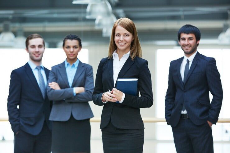 businesspeople-standing-together-office-artifin-accountants